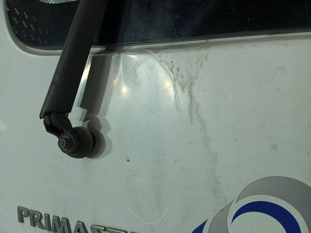 Дверь задняя распашная левая к Nissan  Primastar (02-06)